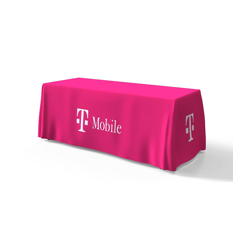 A printed tablecloth showing a bright background colour and a company logo to the front